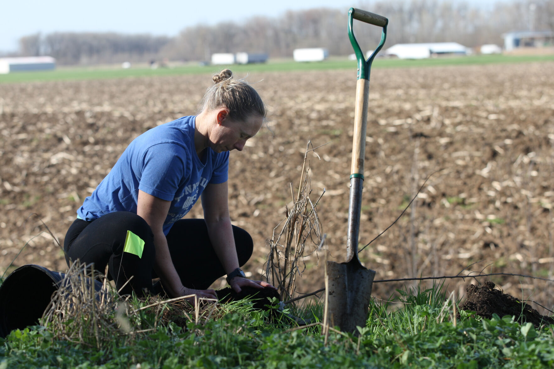 Meghan McCarrick plants a tree